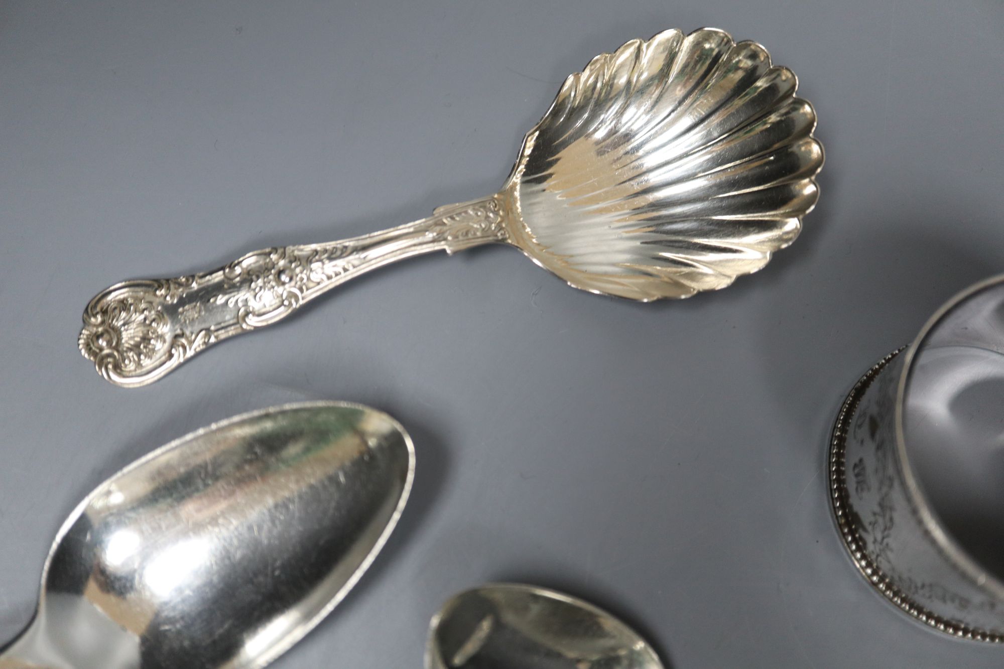 A group of assorted 19th century silver flatware including two caddy spoons (one Scottish) and a napkin ring,